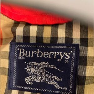 Inquiries BURBERRY  rare limited red trench
23" pit to pit
48" shoulder to hem
